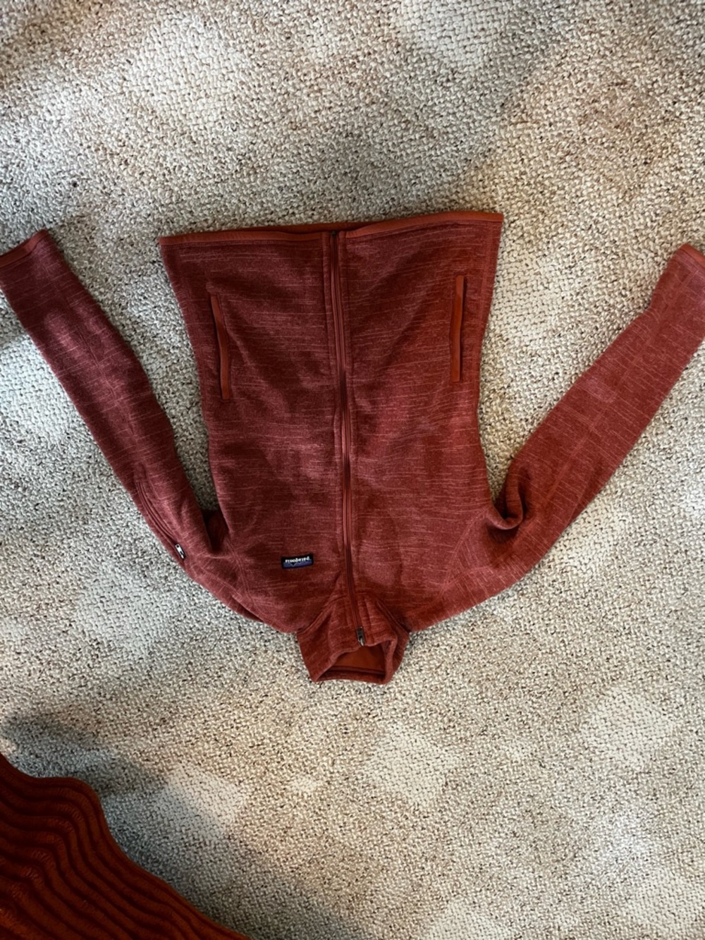 Patagonia zip-up fleece in rust pink
